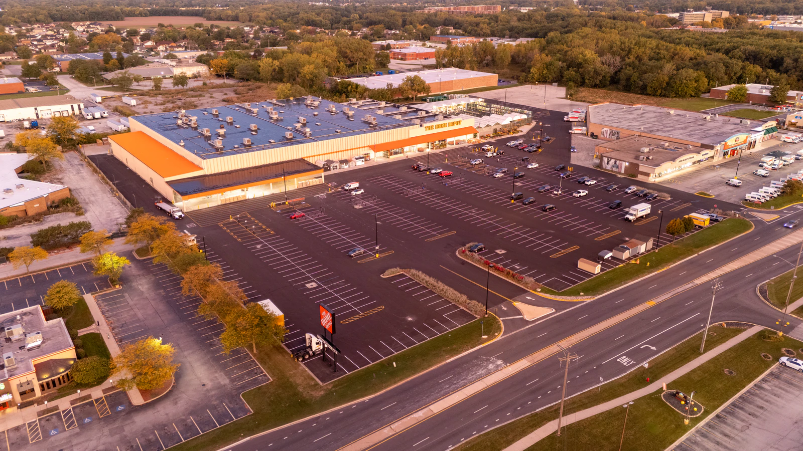 Dawn aerial view of Home Depot parking lots repaved and striped by Advantage Paving