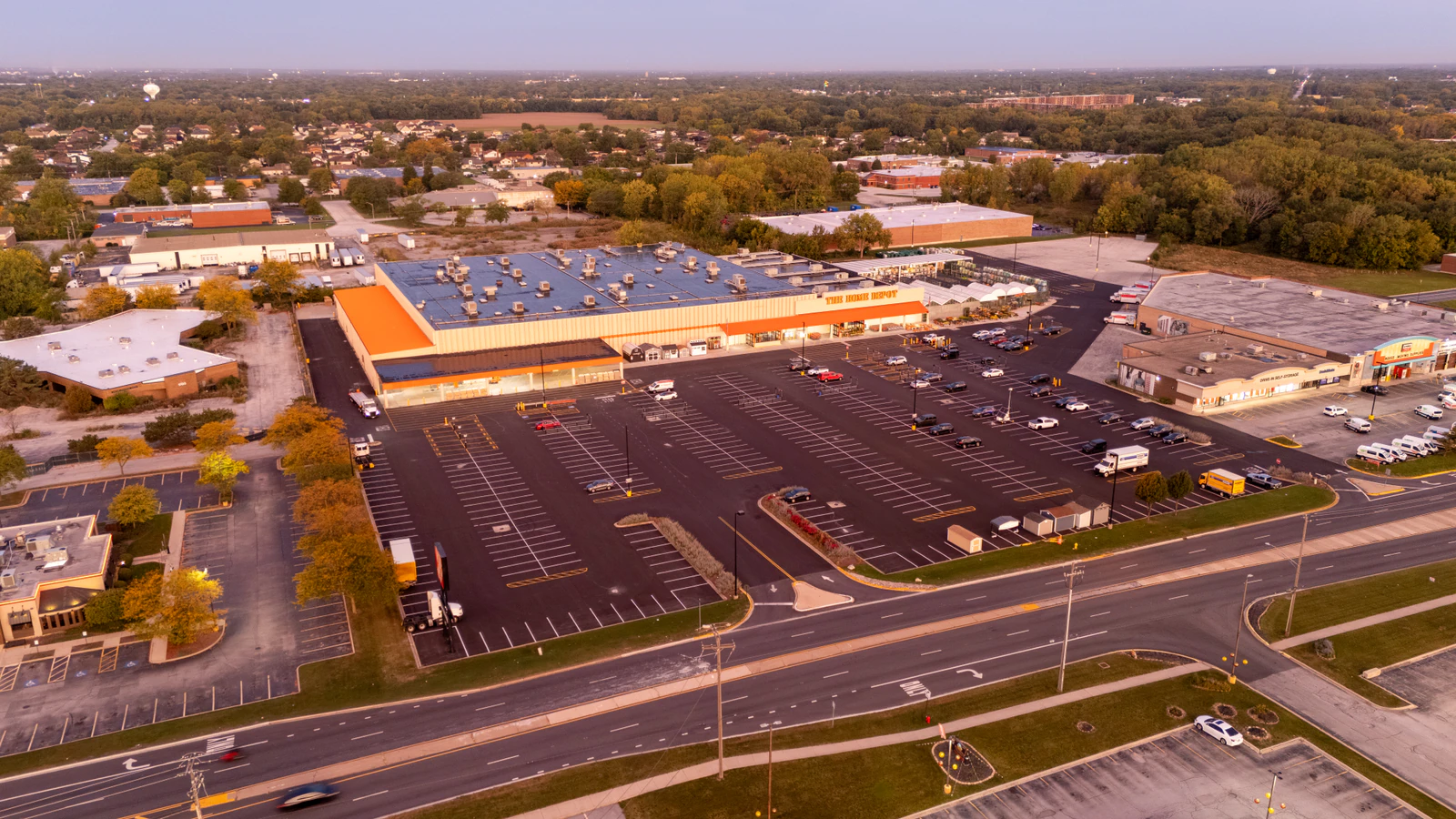 Dawn aerial view of Home Depot parking lots repaved and striped by Advantage Paving