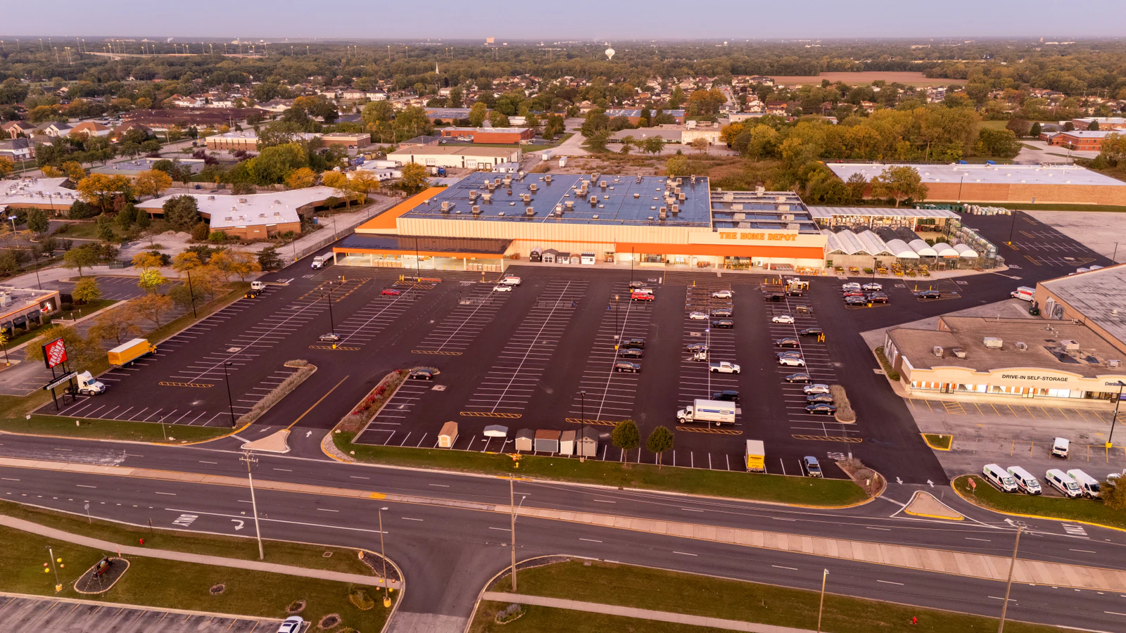 Dawn aerial view of Home Depot parking lots repaved and striped by Advantage Paving