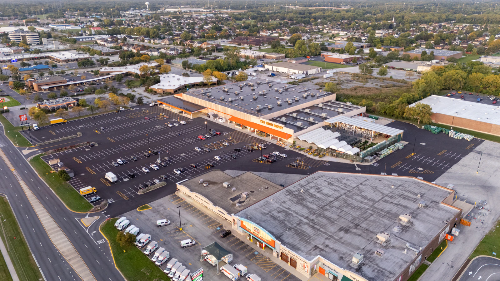 Dawn aerial view of Home Depot parking lots repaved and striped by Advantage Paving