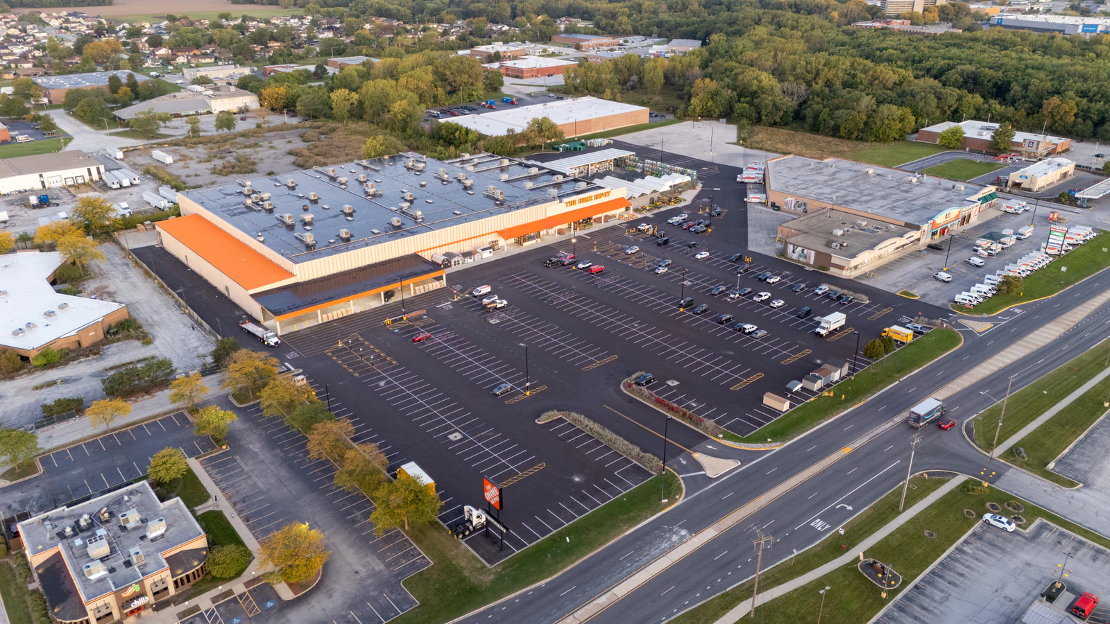 Dawn aerial view of Home Depot parking lots repaved and striped by Advantage Paving