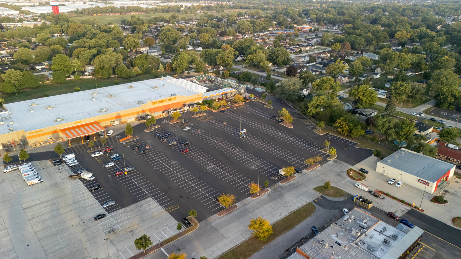 Dawn aerial view of Home Depot parking lots repaved and striped by Advantage Paving