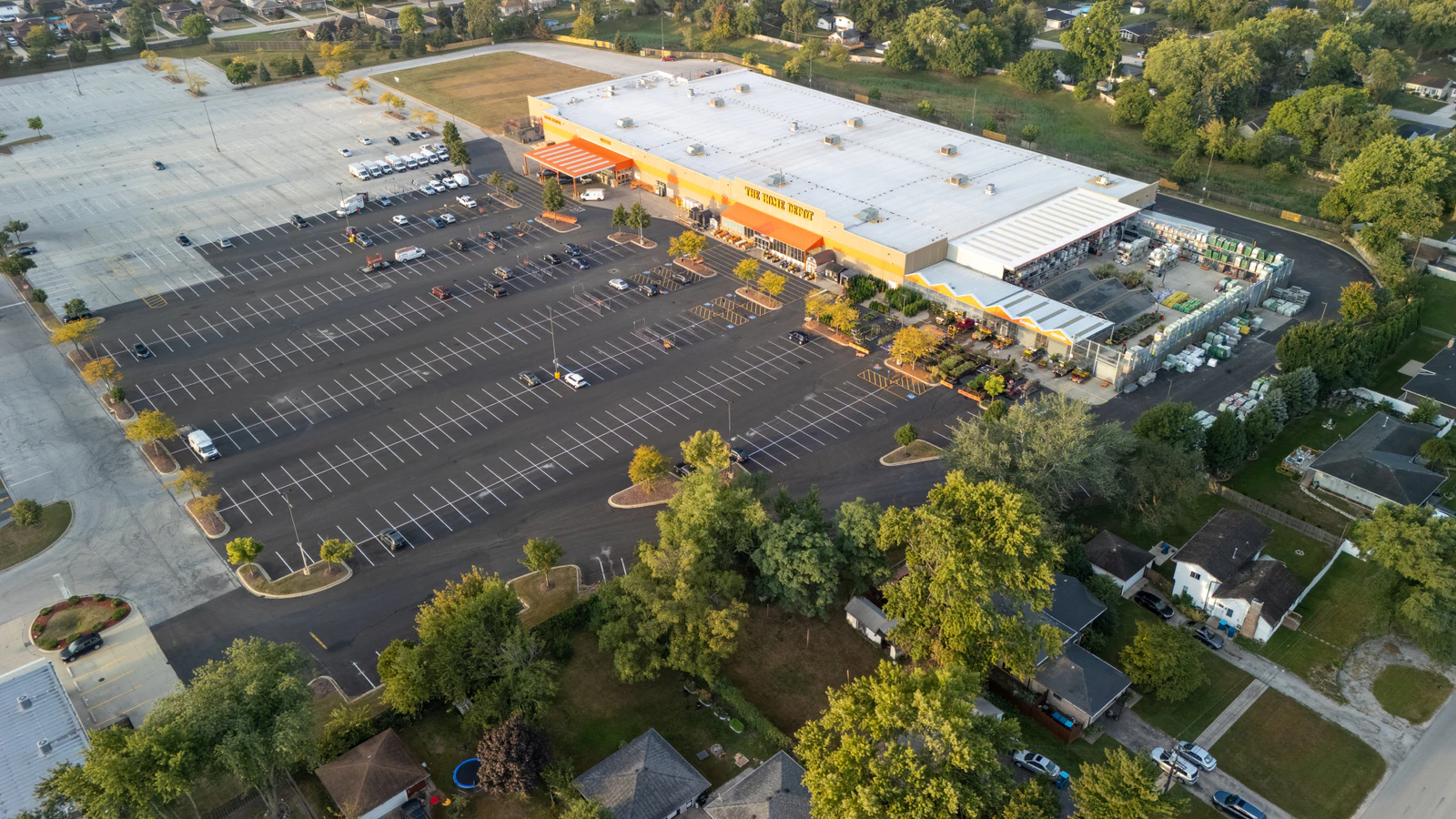Dawn aerial view of Home Depot parking lots repaved and striped by Advantage Paving