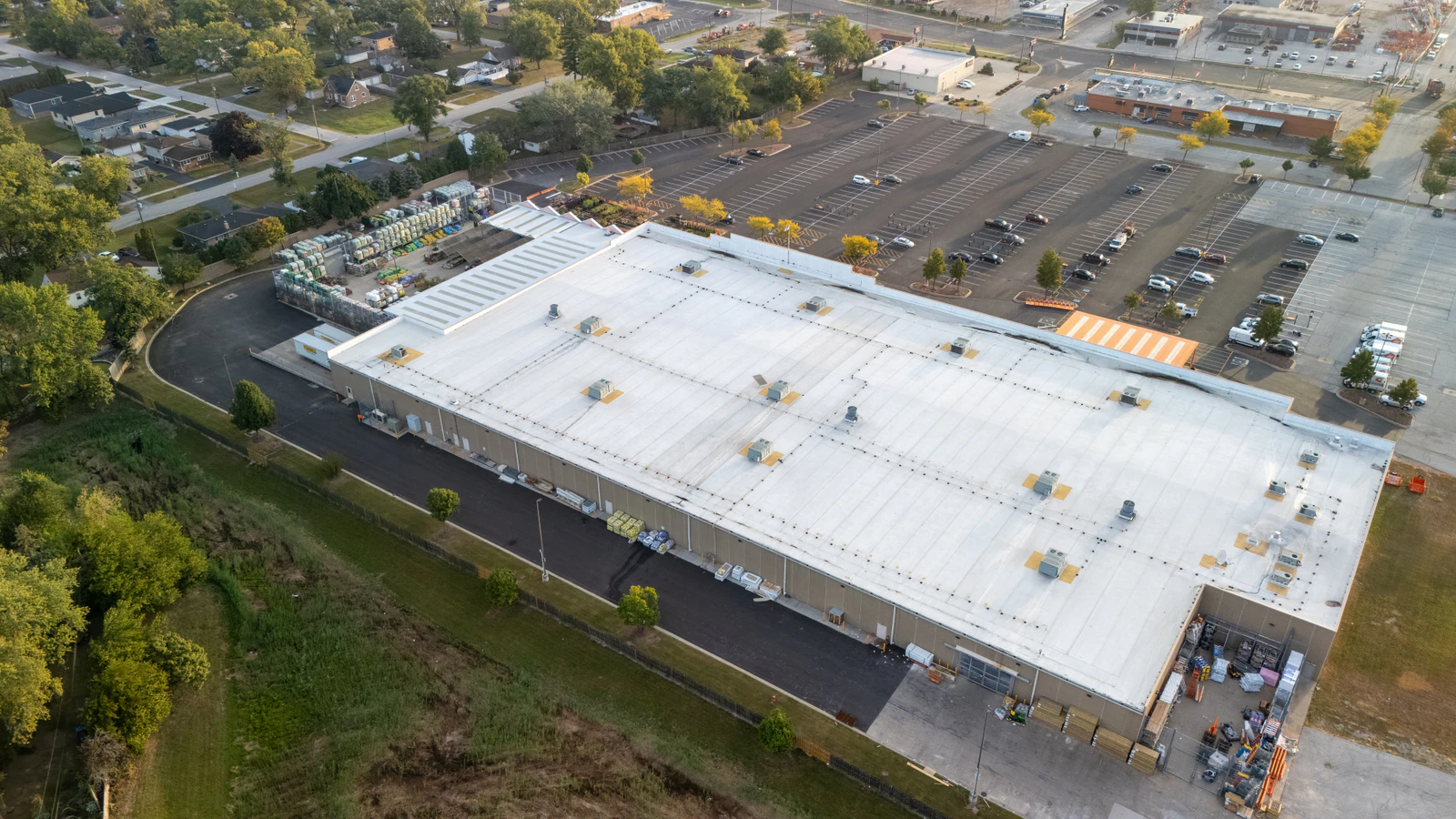 Aerial view of the Home Depot store and its repaved parking lots at dusk