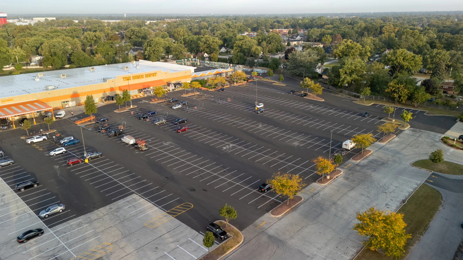 Dawn aerial view of Home Depot parking lots repaved and striped by Advantage Paving