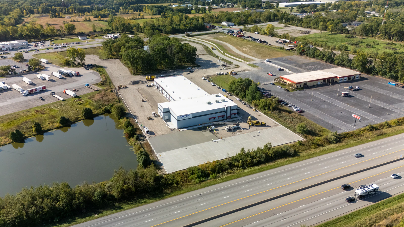 Rihm Kenworth truck dealership — excavation, grading and full-depth concrete parking lot construction by Advantage Paving