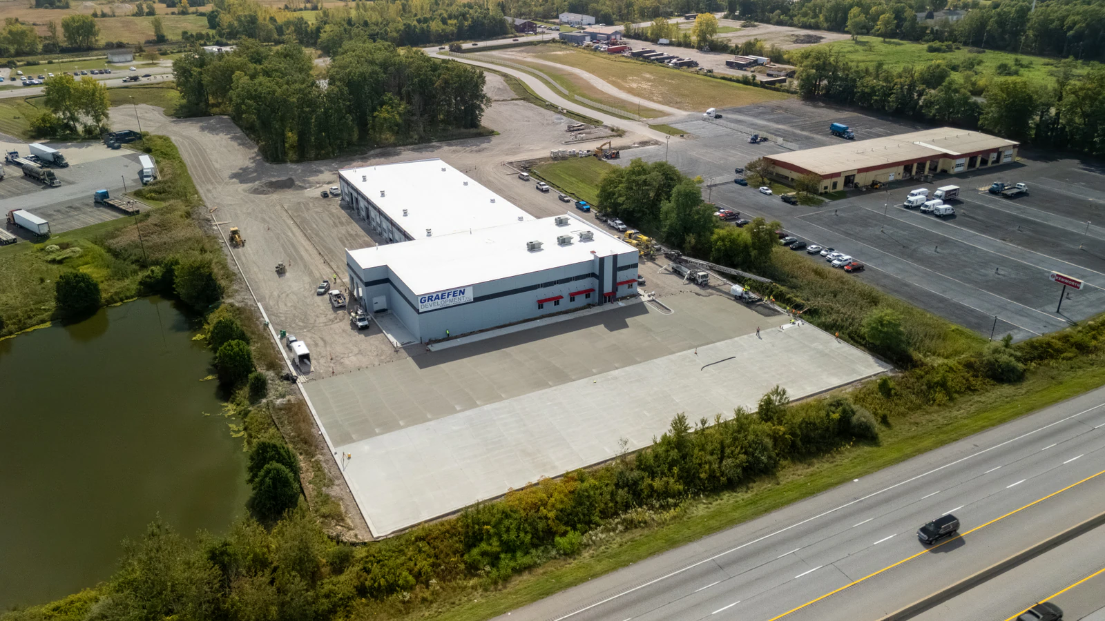 Rihm Kenworth truck dealership — excavation, grading and full-depth concrete parking lot construction by Advantage Paving